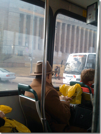 The man is holding a yellow Stockmann 